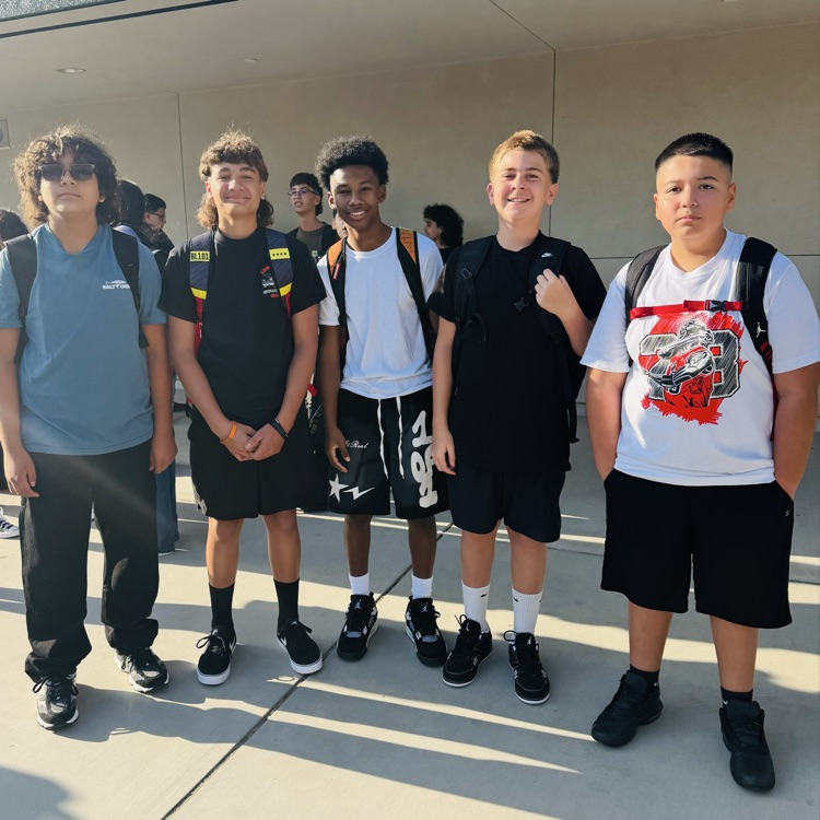 students and staff smiling on the first day of school