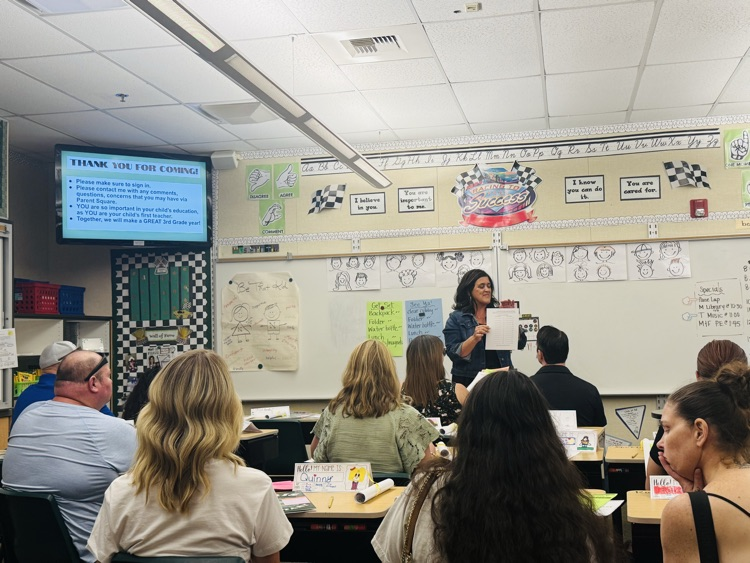 Teacher presenting to parents