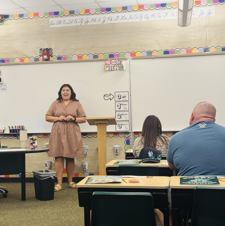 Teacher presenting to parents