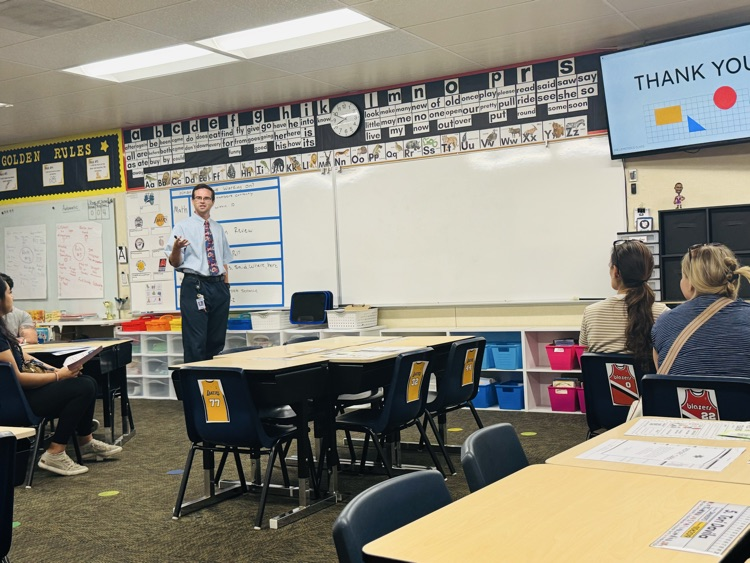 Teacher presenting to parents