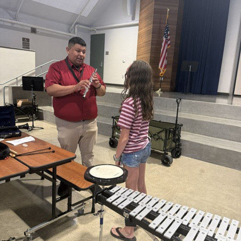 Student sampling an instrument