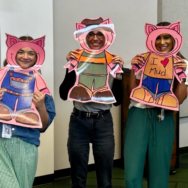 teachers posing with reading illustration cut outs