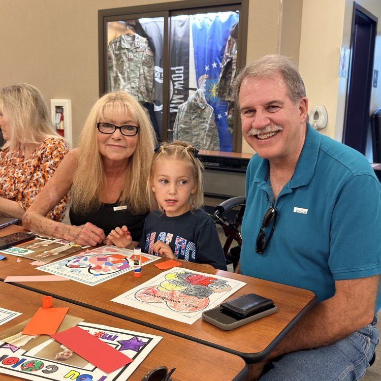Grandparents doing art with grandchild