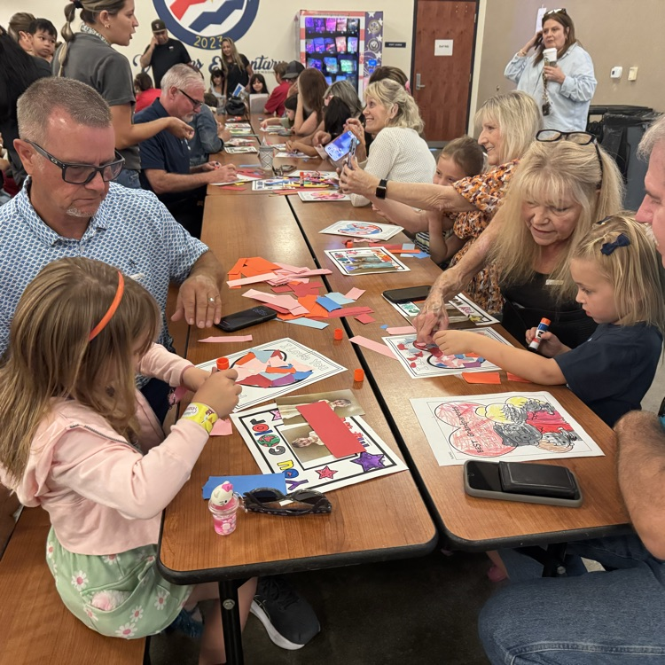 Grandparents doing art with grandchild