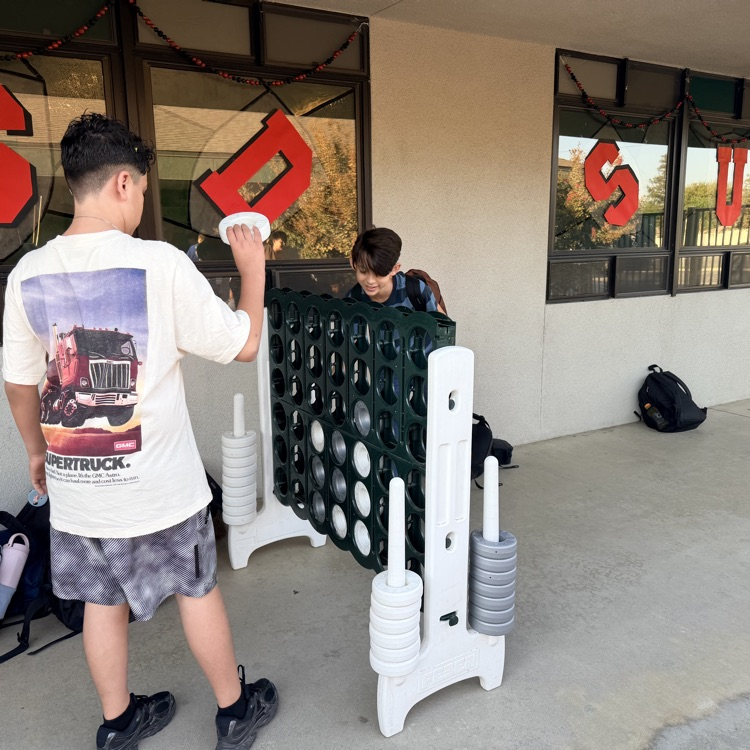 Students playing giant size Connect Four