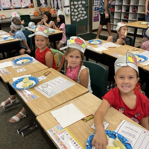 students tasting apples and doing apple activities