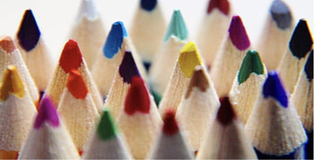 Colored pencils in a rainbow of colors with sharpened tips