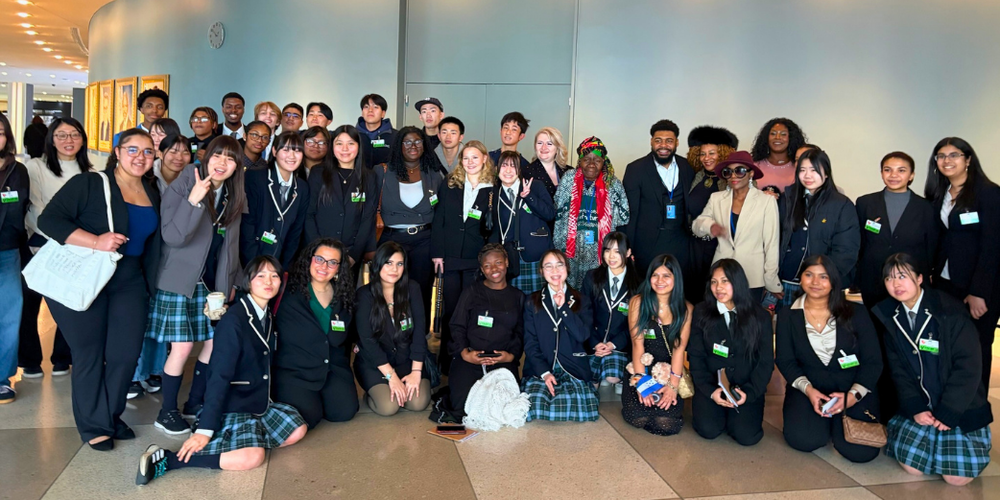 Students pose for large group photo.