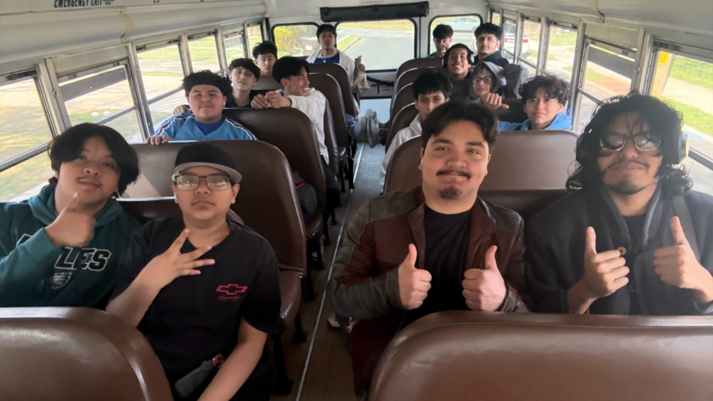 Students sitting on bus on their way to the game