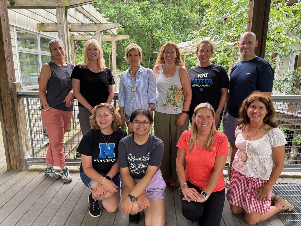 Teachers posing for a group photo.