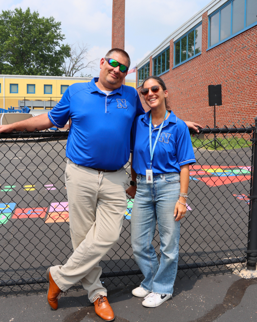 Two NASD staff members pose for photo.