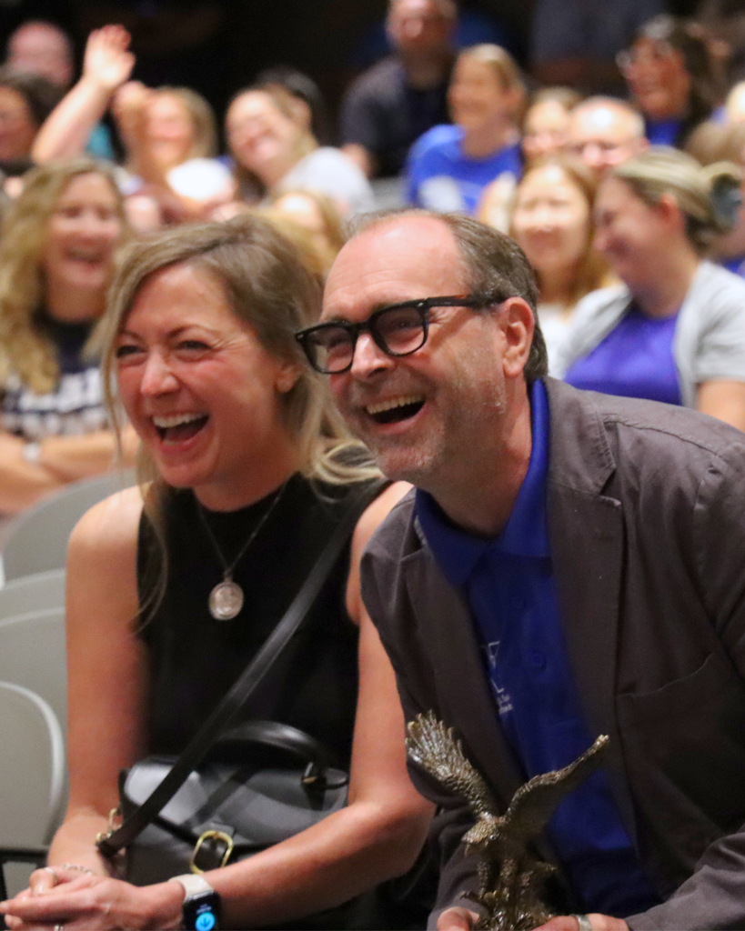 Mr. Stansbery and his wife smiling in the audience.