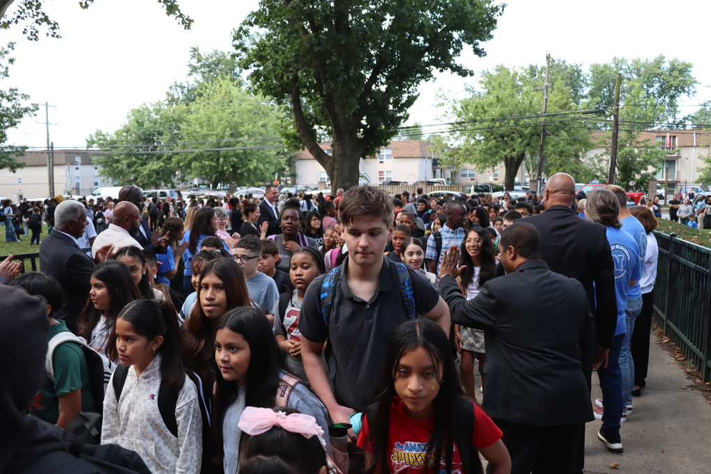Crowds of students entering Blockson Middle School.  More information in caption