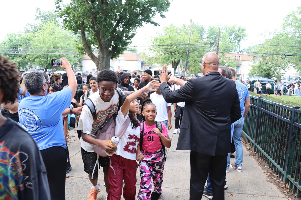 Crowds of students entering Blockson Middle School.  More information in caption