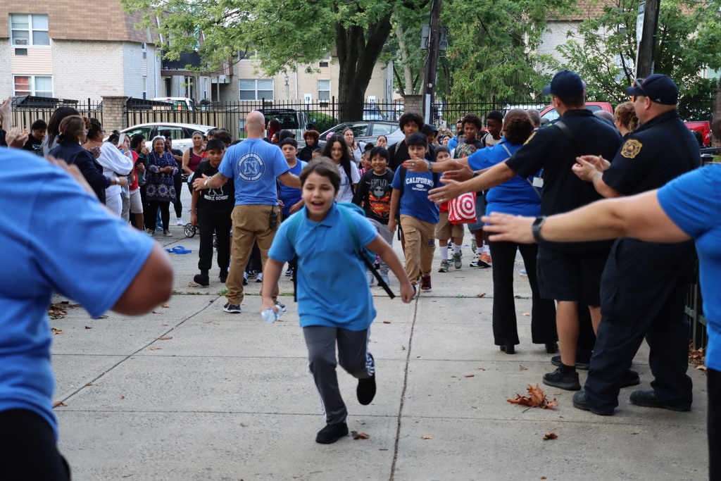 Crowds of students entering Blockson Middle School.  More information in caption