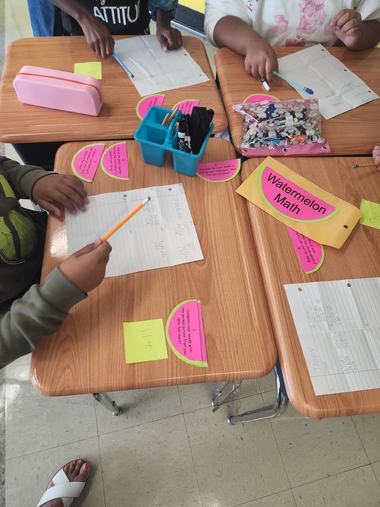 A group of students completing math work. 