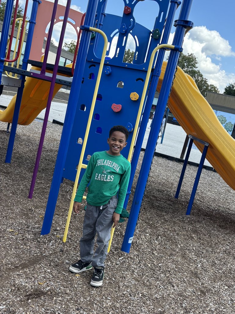 A student at recess ready to cheer on the Eagles!