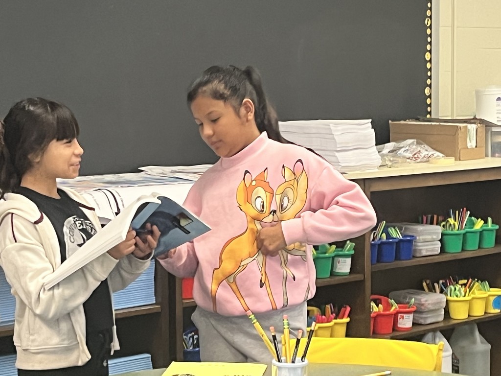 Students conversing with each other. More info in caption