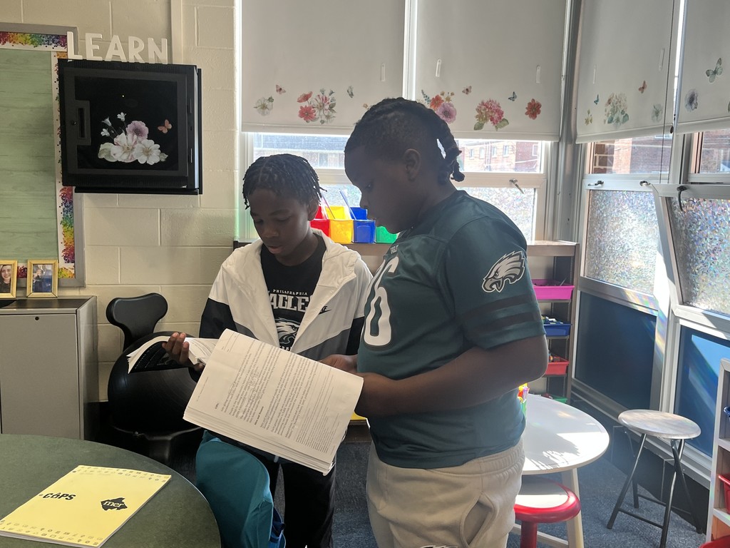 Students conversing with each other. More info in caption