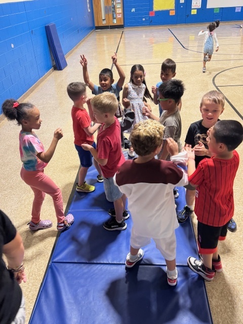 A group of students working together in physical education class. 
