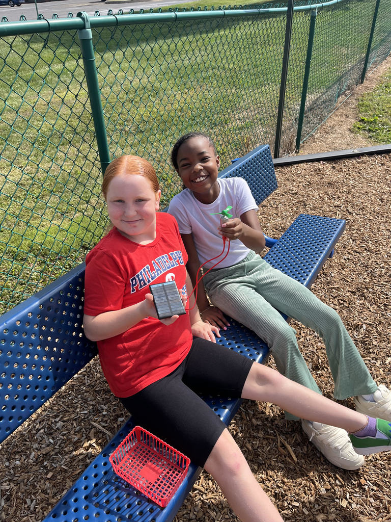 Two Fourth Graders showing their electrical circuit.