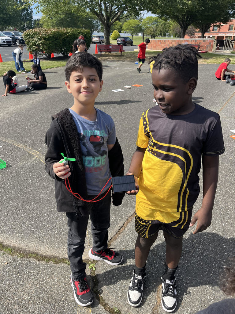 Two Fourth Graders showing their electrical circuit.