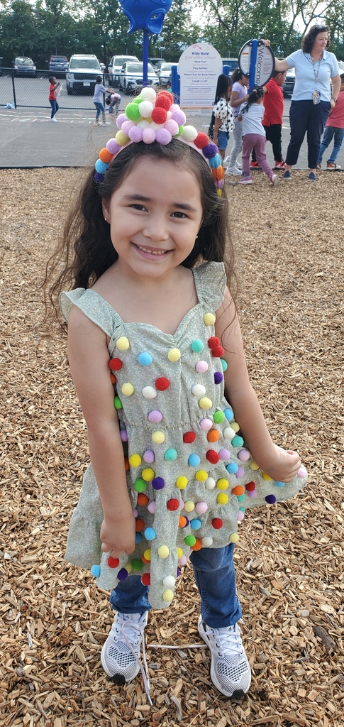 Students playing on playground showing their costume creation with dots to celebrate international dot day.