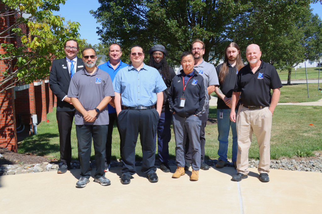 IT team poses for a group photo. 