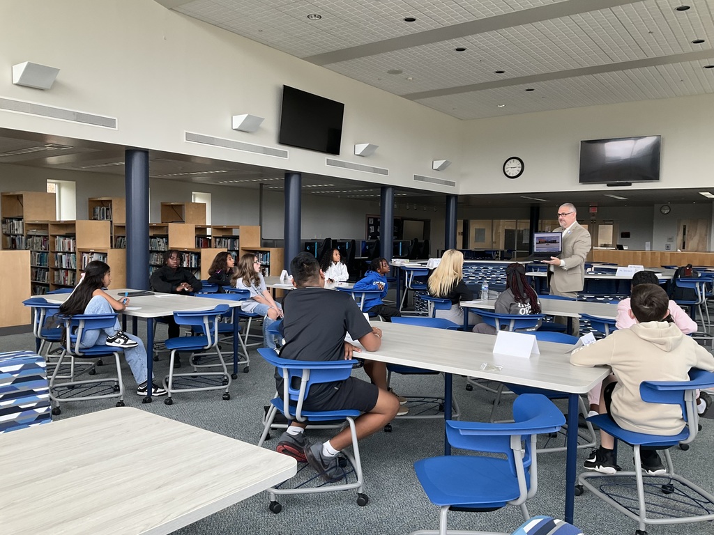 Students looking at photos on computer 