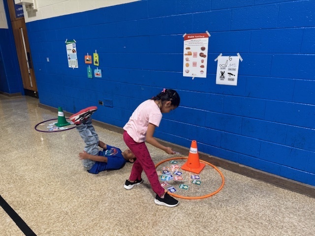 Two students working together in physical education class