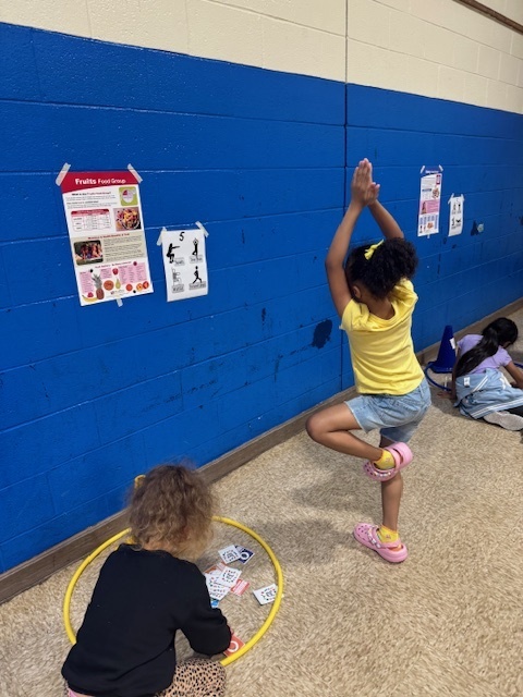 Two students working together in physical education class