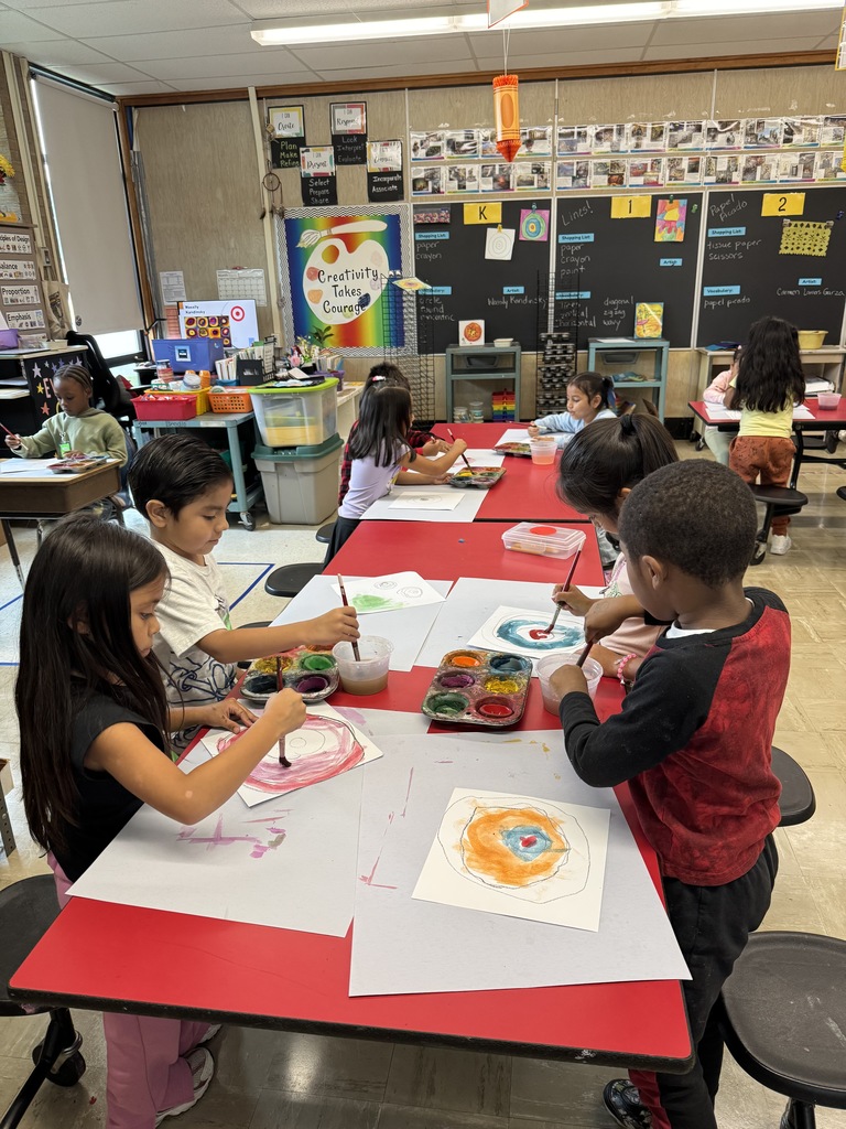 Kindergartners painting for Dot Day.