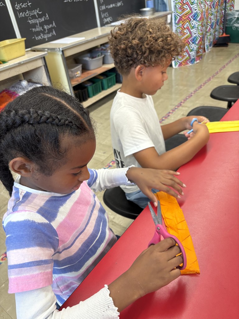 Students cut their papel picado projects.