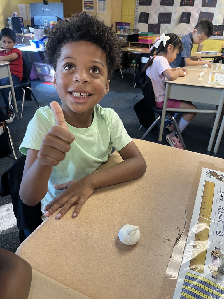 Students making clay pumpkins