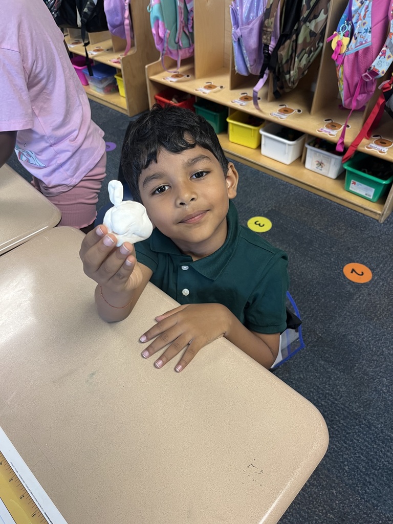 Students making clay pumpkins