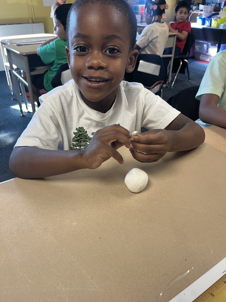 Students making clay pumpkins