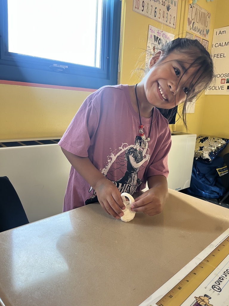 Students making clay pumpkins