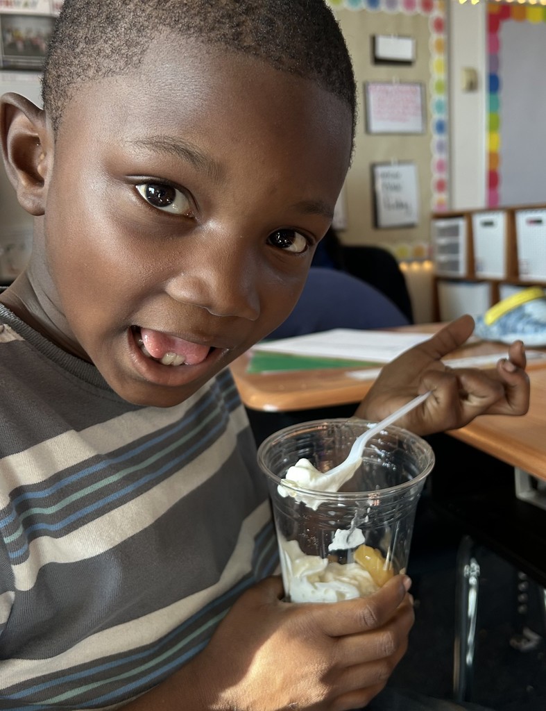 Photo of student celebrating Johnny Appleseed's Birthday with a sweet treat.