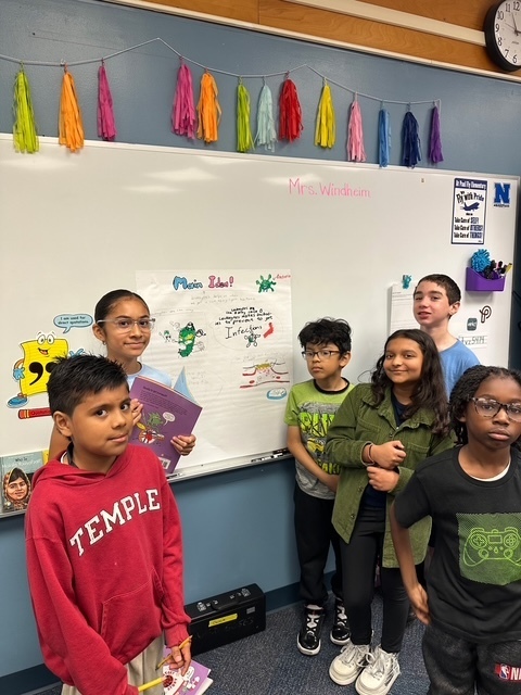 Students making a graffiti wall. 