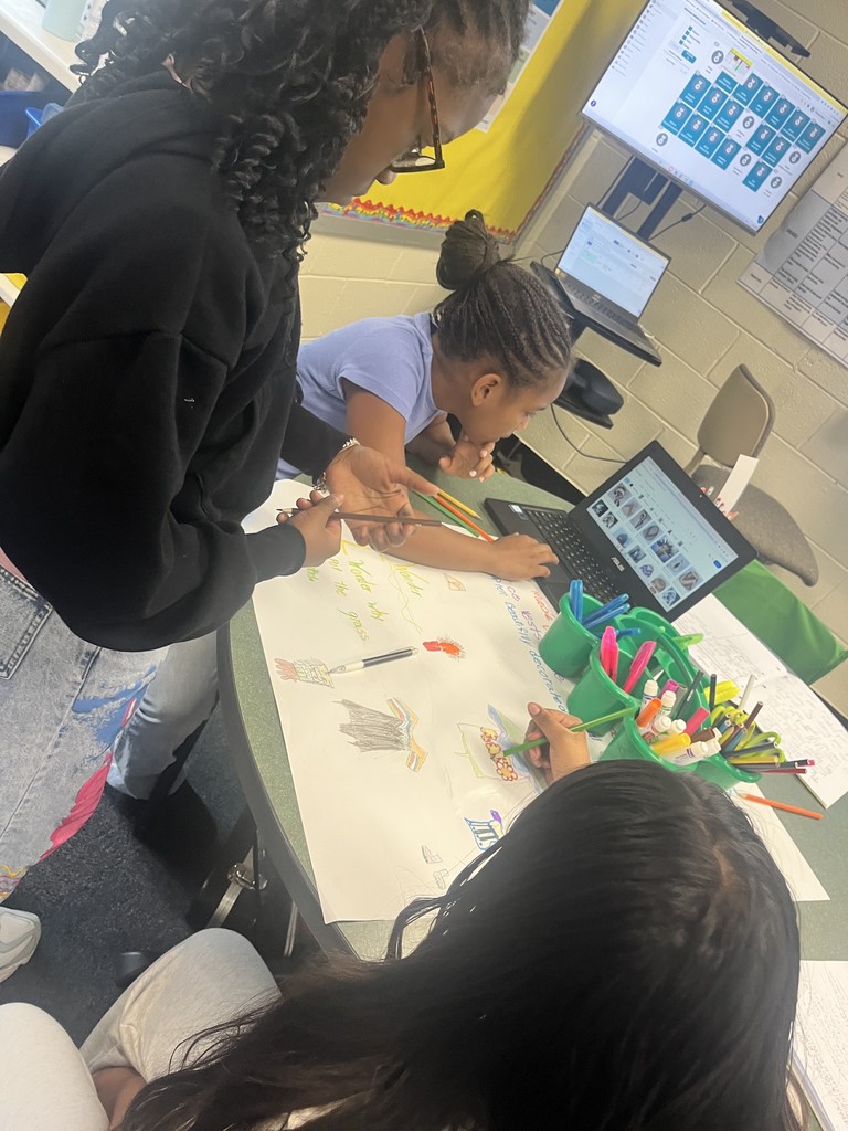 Students working on an ELA project. More information in caption.