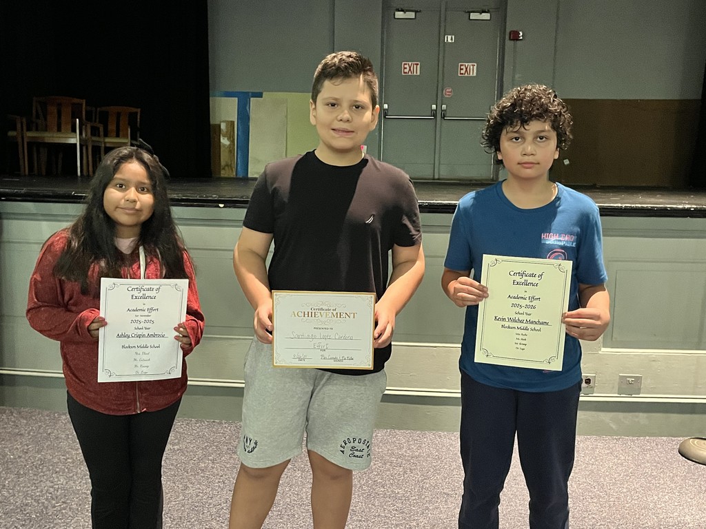Students holding award certificates