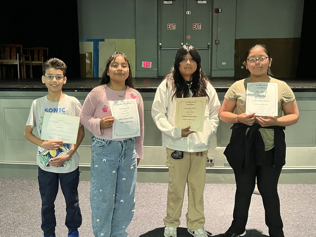 Students holding award certificates