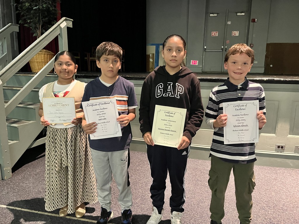 Students holding award certificates