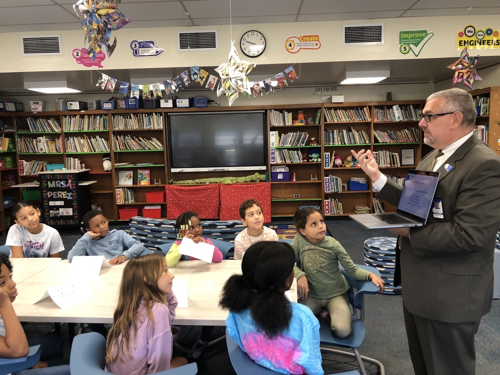 Students having a conversation with Mr. Dormer