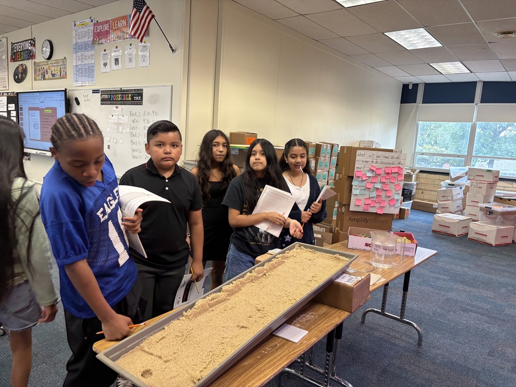 Students studying stream table. More info in caption