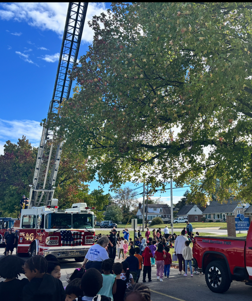 Students meet firefighters and view fire equipment.