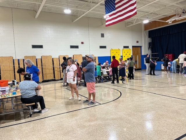 Families at stations at a science event