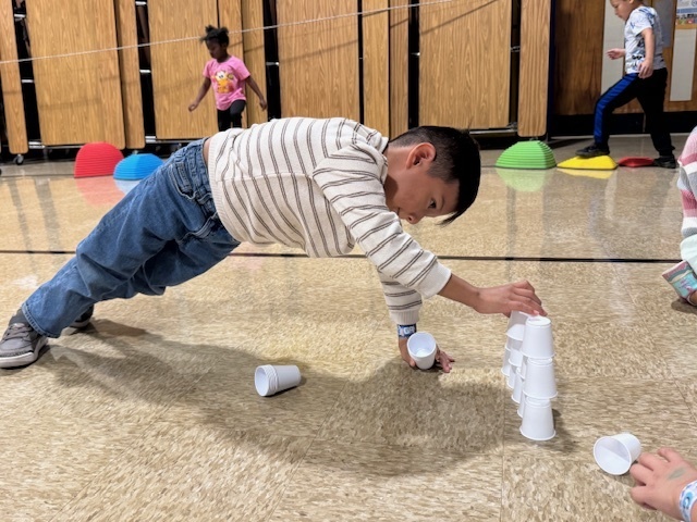 A student stacking cups