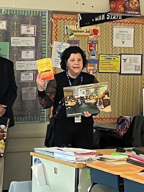 Member of the rotary club presenting to the third grade students. 