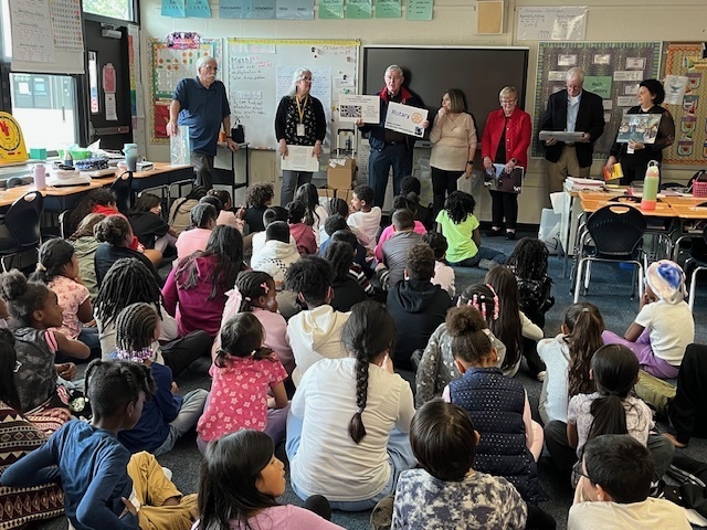 Rotary Club members presenting to third grade students. 